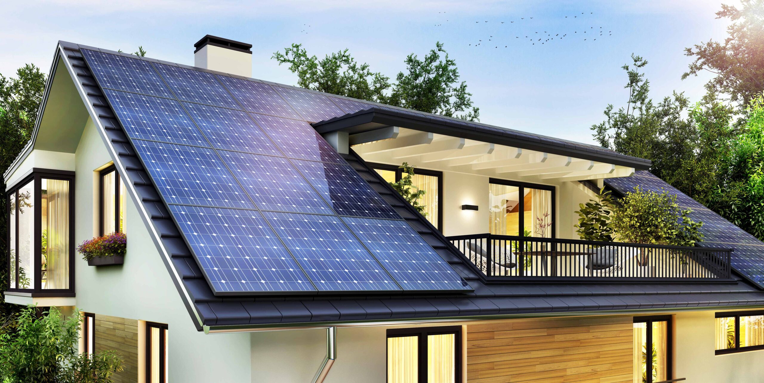Sonnenkollektoren auf dem Satteldach eines schönen modernen Hauses